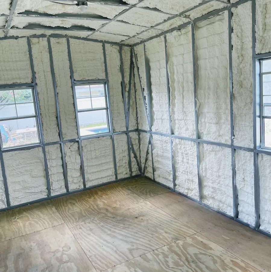 Closed-cell spray foam insulation applied to wall cavities in a residential project in Davison